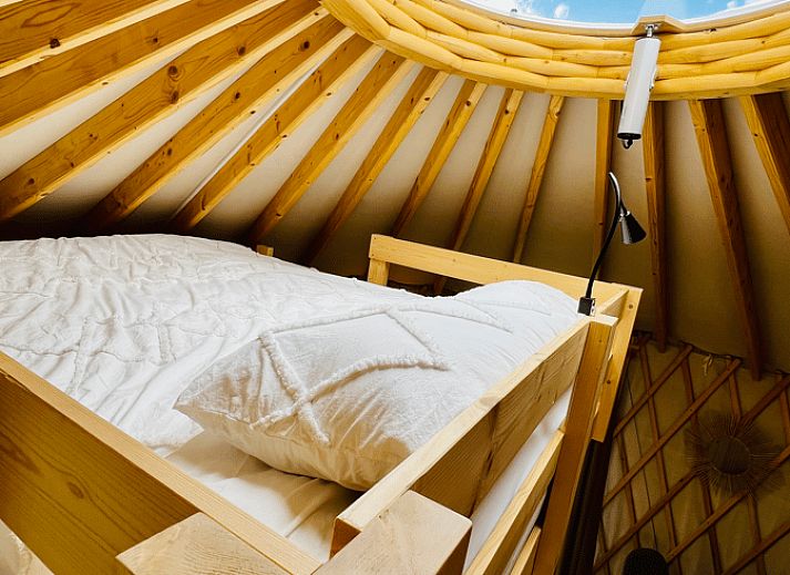 Bright interior of Holiday Home in Ledeacker with comfortable seating and wooden interior.