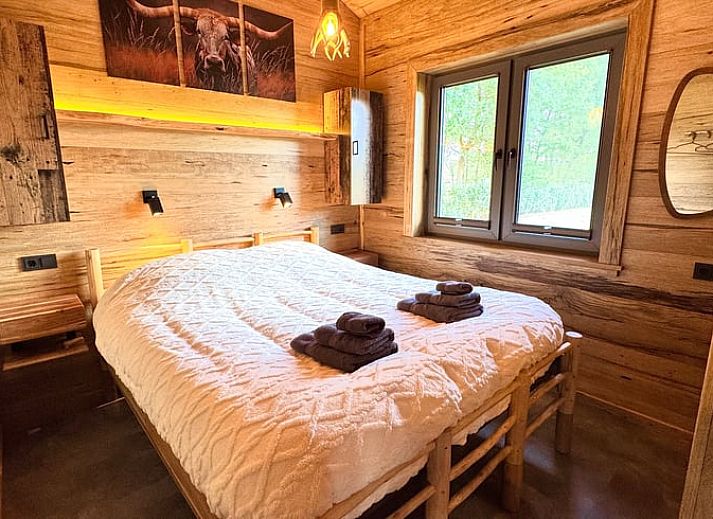 Cozy kitchen and dining area in Holiday Home in Ledeacker, Northeast Brabant with wooden interior and modern amenities.