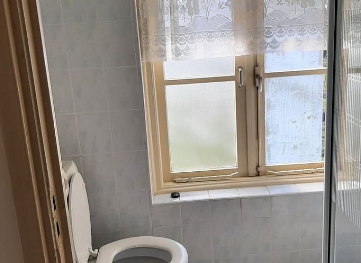 Gezellige slaapkamer in Vakantiehuisje in Keent, Noordoost Brabant. Comfortabel verblijf in Noord Brabant met rustieke charme.