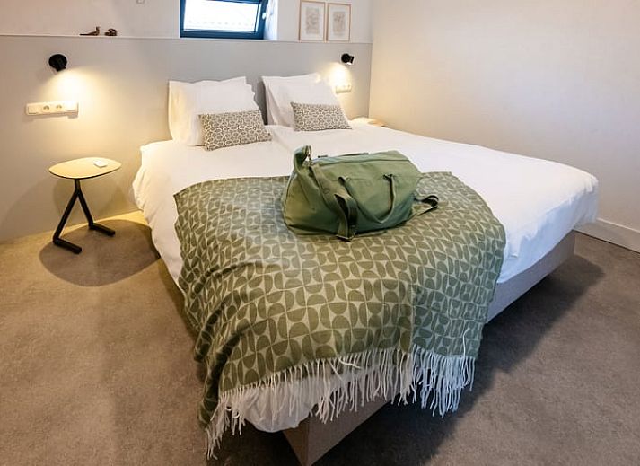 Gemuetlicher Innenbereich des Ferienhauses in Gilze, Westbrabant, mit moderner Kueche und gemuetlicher Sitzecke in Nordbrabant.