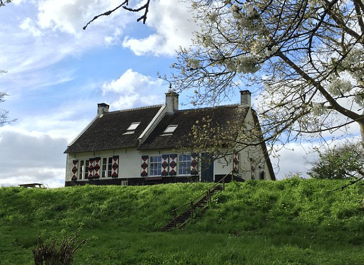 Cozy living room with fireplace in Holiday home in Drimmelen, West Brabant.
