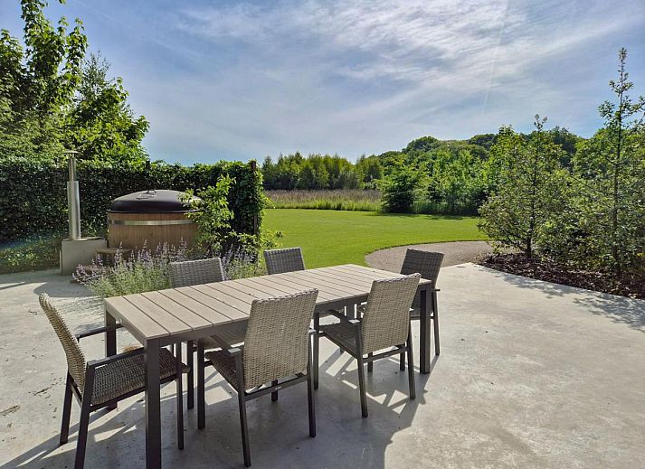 Relax in the hot tub of De Stal vacation home in Rijsbergen, West Brabant surrounded by green surroundings.