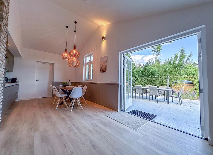 Comfortable bedroom in De Stal vacation home in Rijsbergen, West Brabant with luxurious bed and minimalist design.