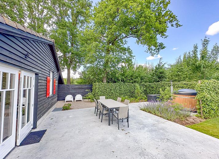 Comfortable bedroom in De Stal vacation home in Rijsbergen, West Brabant with luxurious bed and minimalist design.