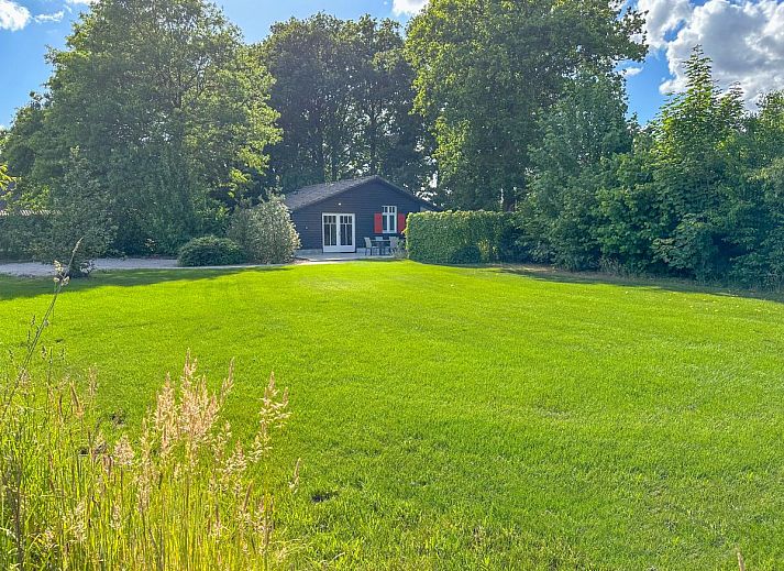 Comfortable bedroom in De Stal vacation home in Rijsbergen, West Brabant with luxurious bed and minimalist design.