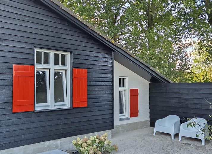 Comfortable bedroom in De Stal vacation home in Rijsbergen, West Brabant with luxurious bed and minimalist design.