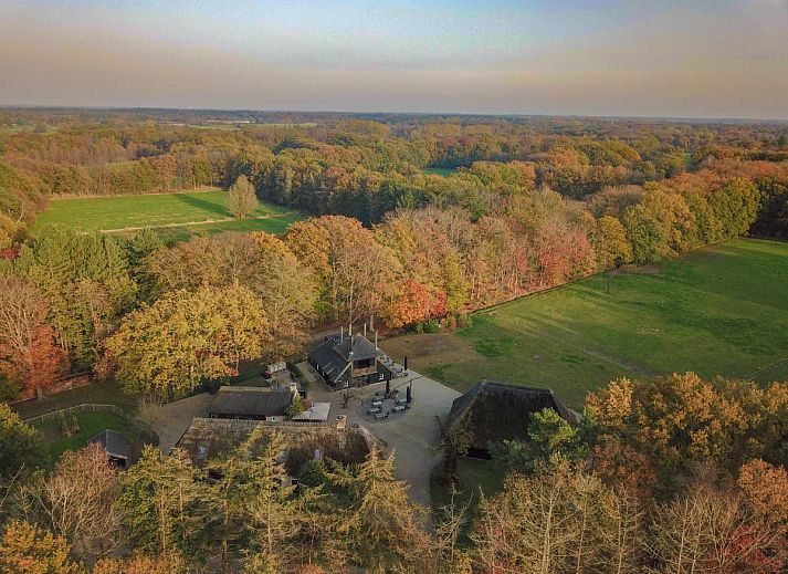 Interior of Jager en Hooijmijt vacation home in Ulvenhout AC, West Brabant, with wooden beams and cozy seating areas.
