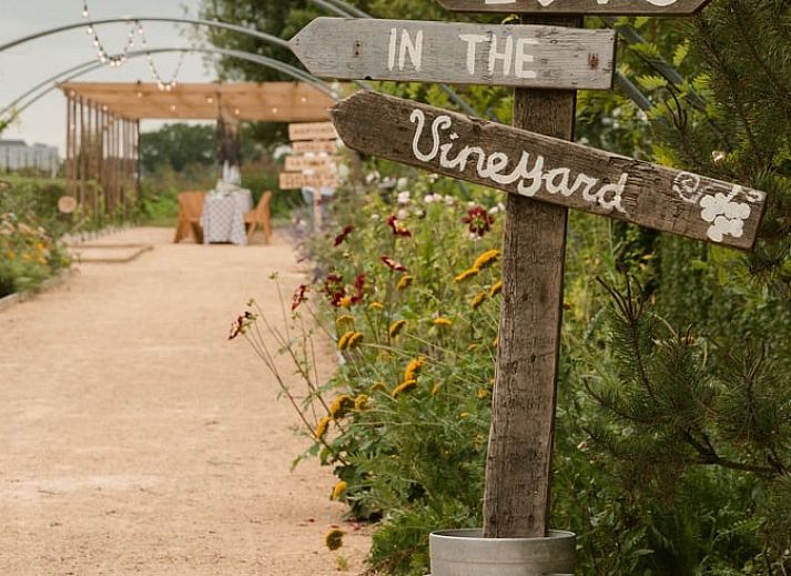 Spacious bedroom in Holiday Home in Fijnaart, North Brabant with wooden floor and cozy furnishings.