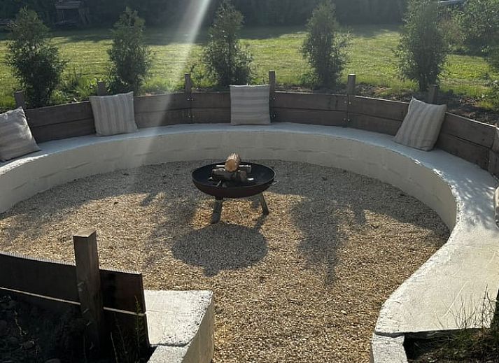 Spacious bedroom in Holiday Home in Fijnaart, North Brabant with wooden floor and cozy furnishings.