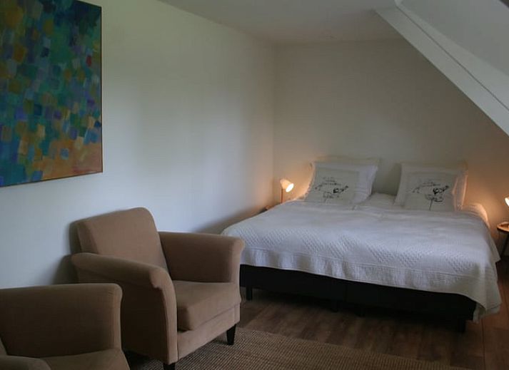 Vakantiehuisje in Moerstraten, gelegen in het groene West Brabant, Noord Brabant, met charmante bakstenen gevel en rustige tuin.