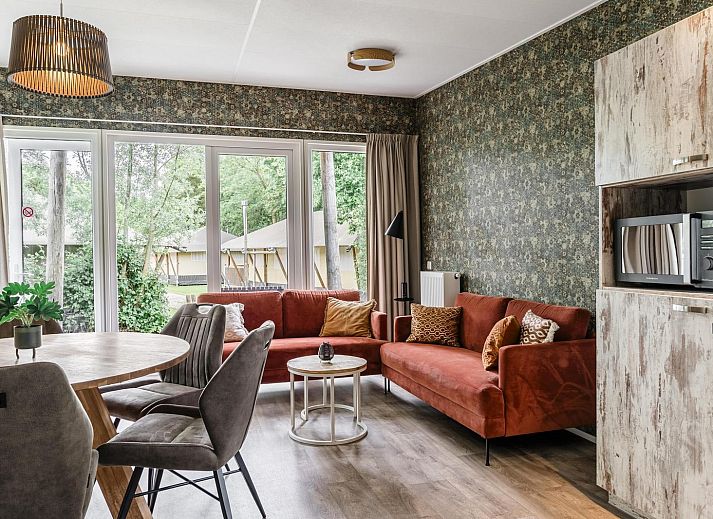 Cozy interior of Beach House sleeps 6 in Julianadorp, North Sea Coast, with modern kitchen and comfortable seating area.