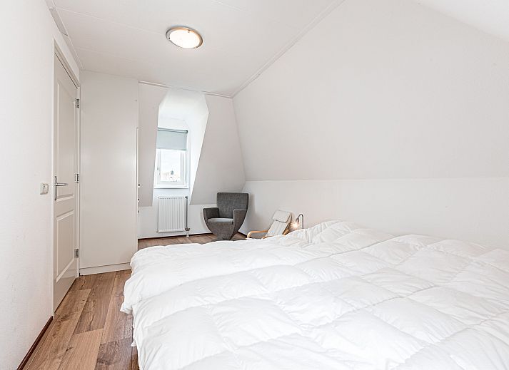 Achtertuin en terras van Vrijstaande woning in Julianadorp, vakantiehuis aan de Noordzeekust, Noord-Holland.