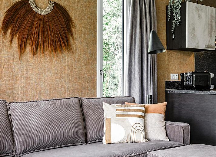 Strandhaus fuer 4 Personen in Julianadorp, Nordseekueste. Geniessen Sie das moderne Ferienhaus mit Terrasse und gruener Umgebung in Nordholland.