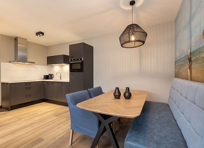 Cozy living room of Apartment 3B in Egmond aan Zee, North Sea coast, North Holland with modern interior and balcony view.