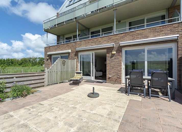 Sunny terrace at Duinerei C002 Groote Keeten vacation home in Callantsoog, North Sea coast, North Holland.