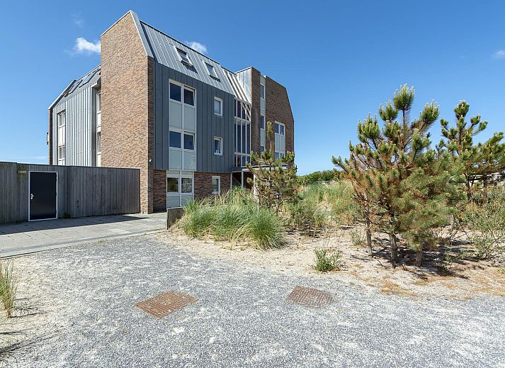 Sunny terrace at Duinerei C002 Groote Keeten vacation home in Callantsoog, North Sea coast, North Holland.