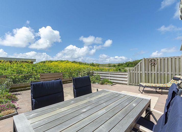 Sunny terrace at Duinerei C002 Groote Keeten vacation home in Callantsoog, North Sea coast, North Holland.