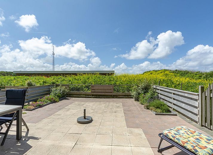 Cozy terrace with view at Duinerei C002 Groote Keeten vacation home in Callantsoog, North Sea coast, North Holland.