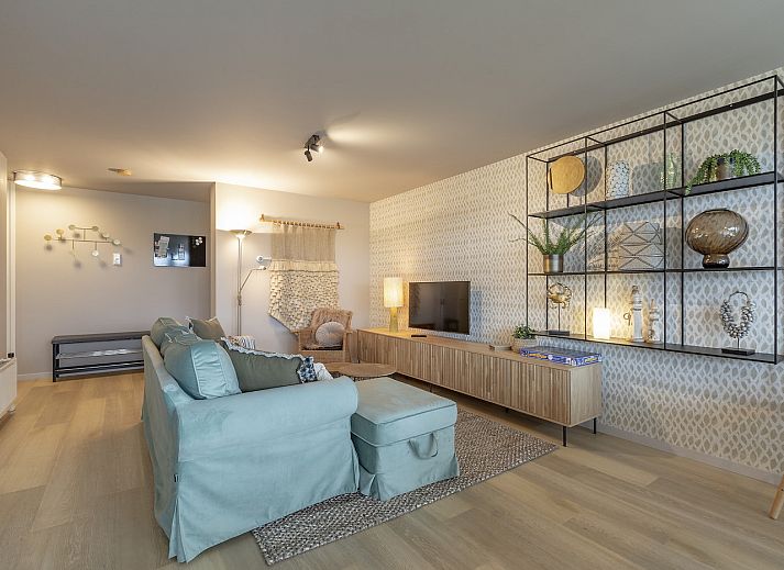 Cozy living room of vacation home Strandleven 006 Groote Keeten in Callantsoog, North Holland.