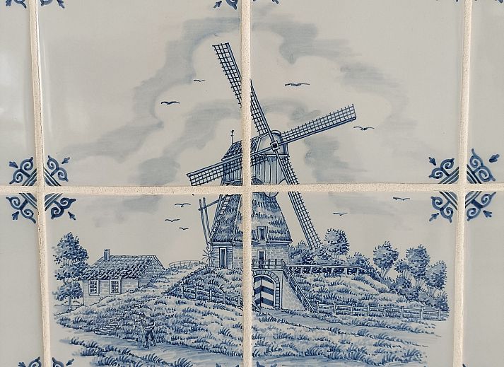 Open woonkamer en keuken in Buitenplaats 062 Callantsoog vakantiehuis in Noord-Holland.