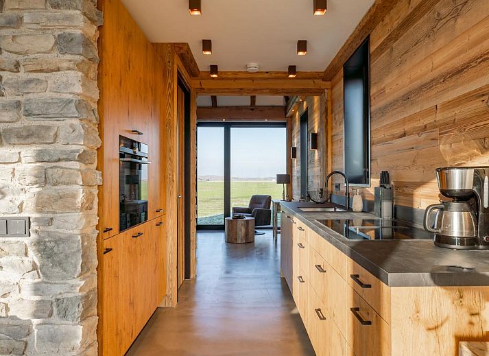 Terrasse des Ferienhauses De Bonte Specht in Callantsoog mit Blick auf die Natur und die Nordseekueste.