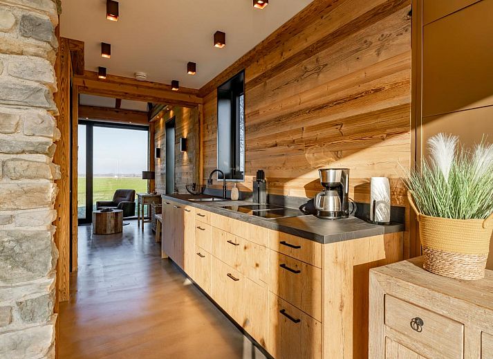 Terrasse des Ferienhauses De Bonte Specht in Callantsoog mit Blick auf die Natur und die Nordseekueste.