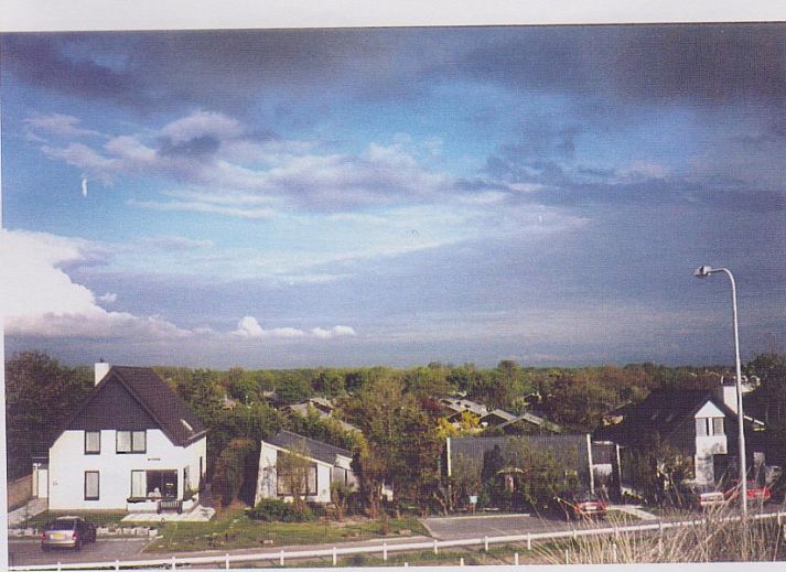 Front of vacation home at Vakantiepark Houdewind, with terrace and garden in Sint Maartenszee, North Sea coast, North Holland.