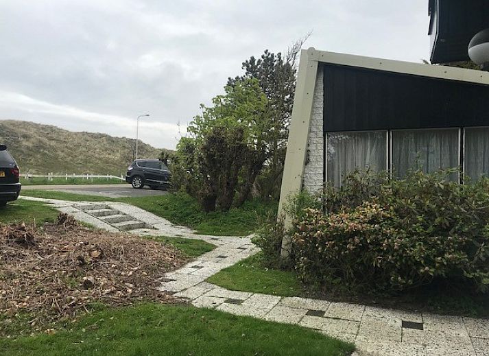 Unique architecture of vacation home at Holiday Park Houdewind in Sint Maartenszee, surrounded by greenery, North Sea coast, North Holland.