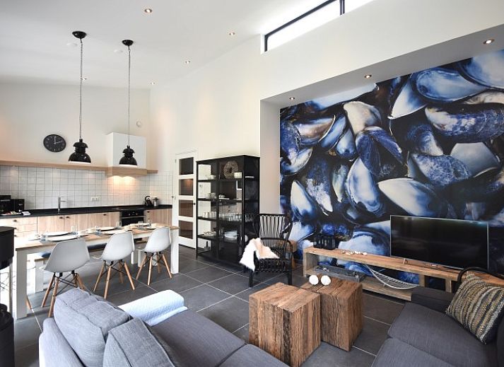 Beach villa bungalow in Sint Maartenszee with sunny terrace and green garden on the North Sea coast, North Holland.