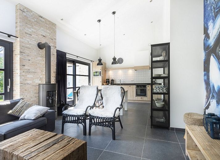 Beach villa bungalow in Sint Maartenszee with sunny terrace and green garden on the North Sea coast, North Holland.