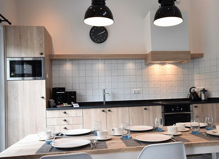 Beach villa bungalow in Sint Maartenszee with sunny terrace and green garden on the North Sea coast, North Holland.