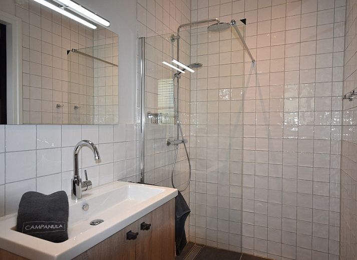 Stylish living room of Beachvilla bungalow in Sint Maartenszee with modern furnishings, North Sea coast, North Holland.