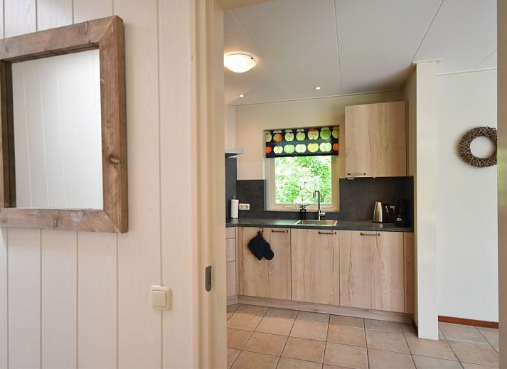 Spacious terrace at Bungalow type D, sleeps 6 in Sint Maartenszee, North Sea coast, North Holland with garden and deck chairs.