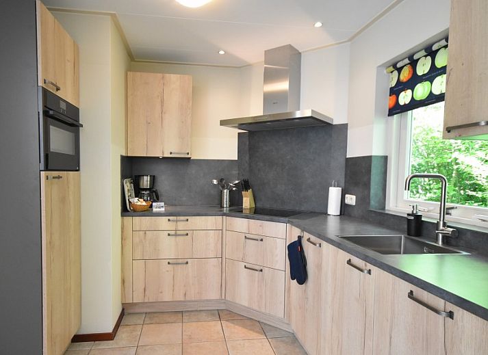 Spacious terrace at Bungalow type D, sleeps 6 in Sint Maartenszee, North Sea coast, North Holland with garden and deck chairs.