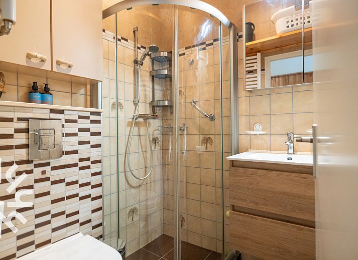 Privetuin met hangmat bij NH294 vakantiehuis in Schoorldam, Noordzeekust, Noord-Holland.