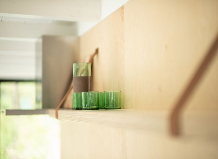Cozy living room of Kennemer Lodge 6 XL in Zandvoort, North Sea coast, North Holland, overlooking the natural surroundings.