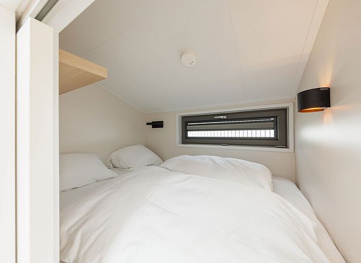 Modern kitchen and dining area in Beach House Sea 4, Zandvoort, North Sea coast, vacation home with stylish decor and natural light.
