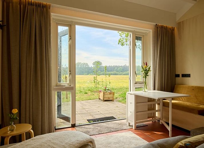 Cozy terrace at Holiday home in Castricum overlooking vast nature, North Sea coast, North Holland.