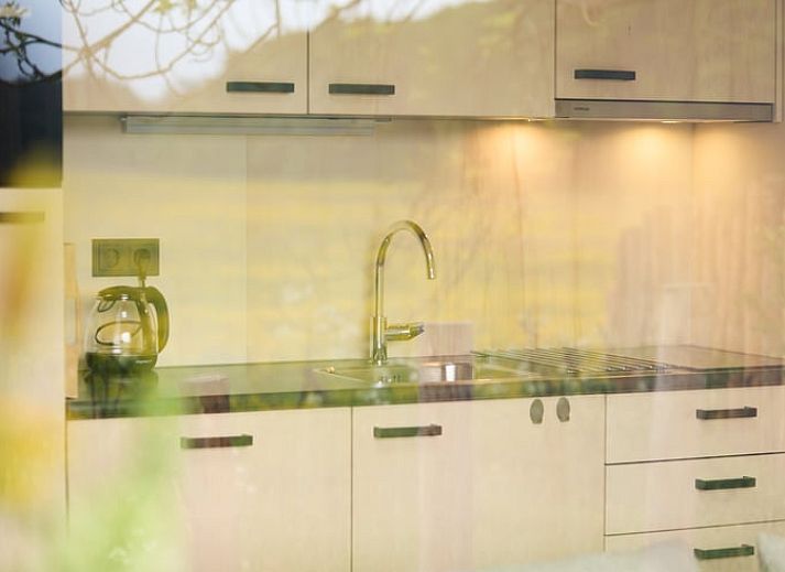 Bright living room with French doors in Holiday home in Castricum, North Sea coast, North Holland.