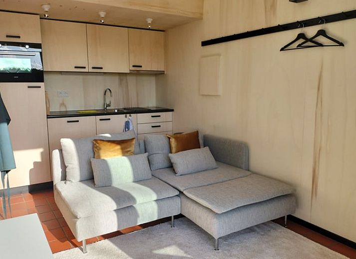 Bright living room with French doors in Holiday home in Castricum, North Sea coast, North Holland.