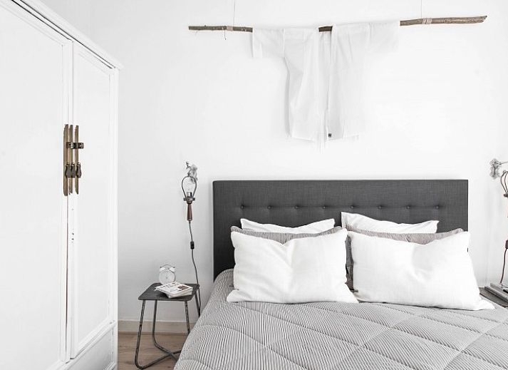 Comfortable bedroom in Villa Beau Lieu, Bergen, North Sea coast, North Holland, with luxurious bed and stylish interior.