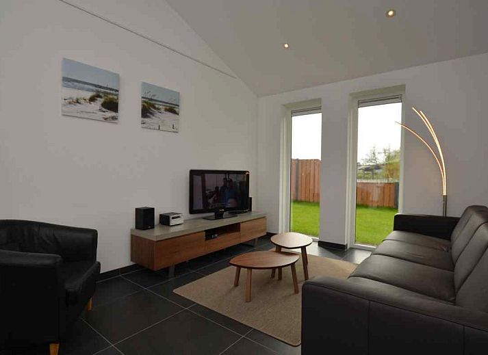 Terrace of vacation home NH114 in Julianadorp aan Zee, North Holland, with modern outdoor space.