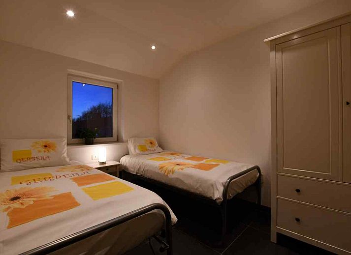 Cozy bedroom in NH114 vacation home, Julianadorp aan Zee, North Holland, with comfortable bed.