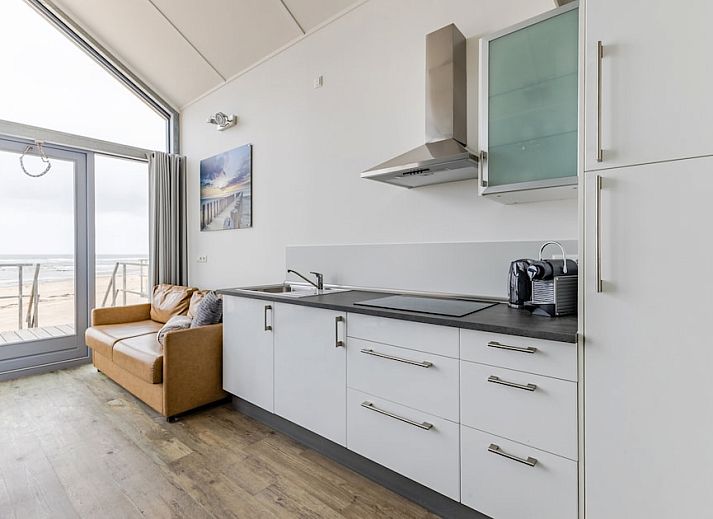 Beach House 4-6, a beach house in Julianadorp aan Zee, North Holland, with modern veranda and views of the dunes on the North Sea coast.