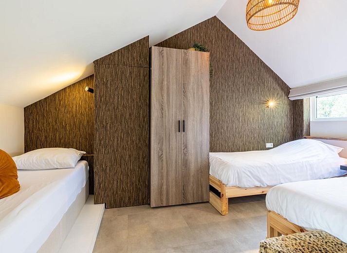 Comfortable bedroom in vacation home Rekerlanden 1, Warmenhuizen, North Sea coast, North Holland with luxurious beds.