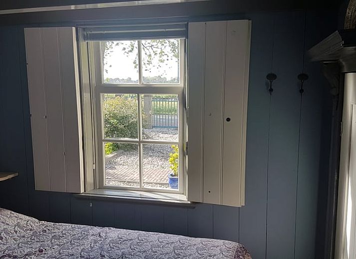 Decorative door knocker in the shape of a lion in cottage Westwoud, North Holland.