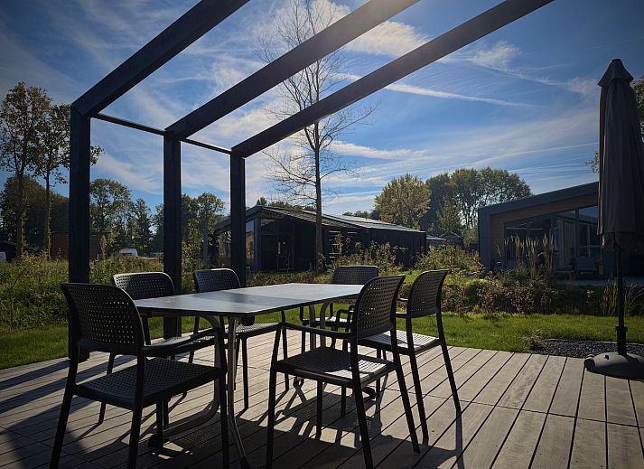 View from the terrace of the detached house in Enkhuizen, vacation home on the IJsselmeer coast, North Holland, with panoramic views of nature.
