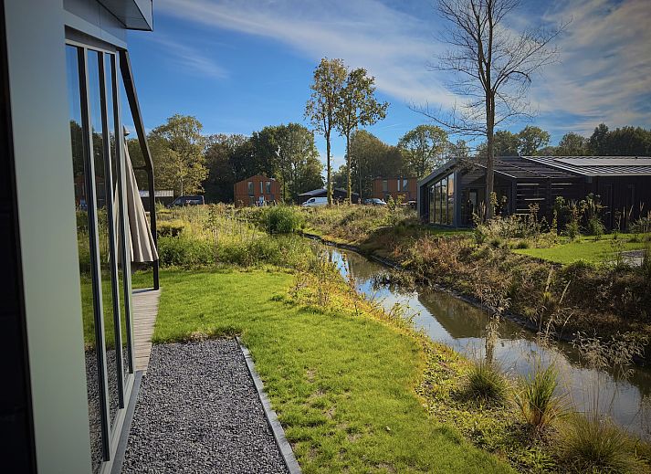 View from the terrace of the detached house in Enkhuizen, vacation home on the IJsselmeer coast, North Holland, with panoramic views of nature.