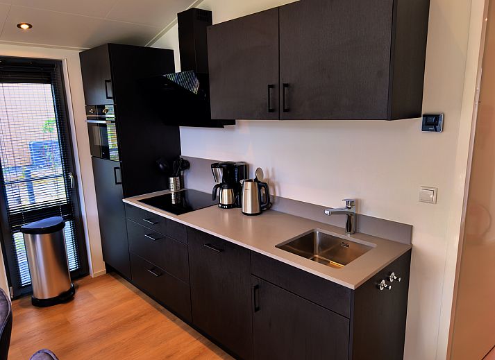 View from the terrace of the detached house in Enkhuizen, vacation home on the IJsselmeer coast, North Holland, with panoramic views of nature.