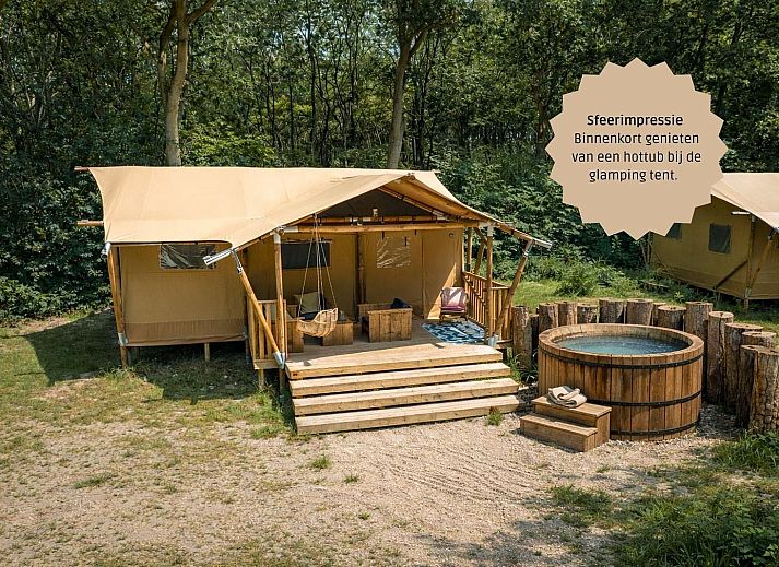 The Stille Heide tent house in Huizen, North Holland, offers a rustic glamping experience with a veranda and surrounding nature on the IJsselmeer coast.